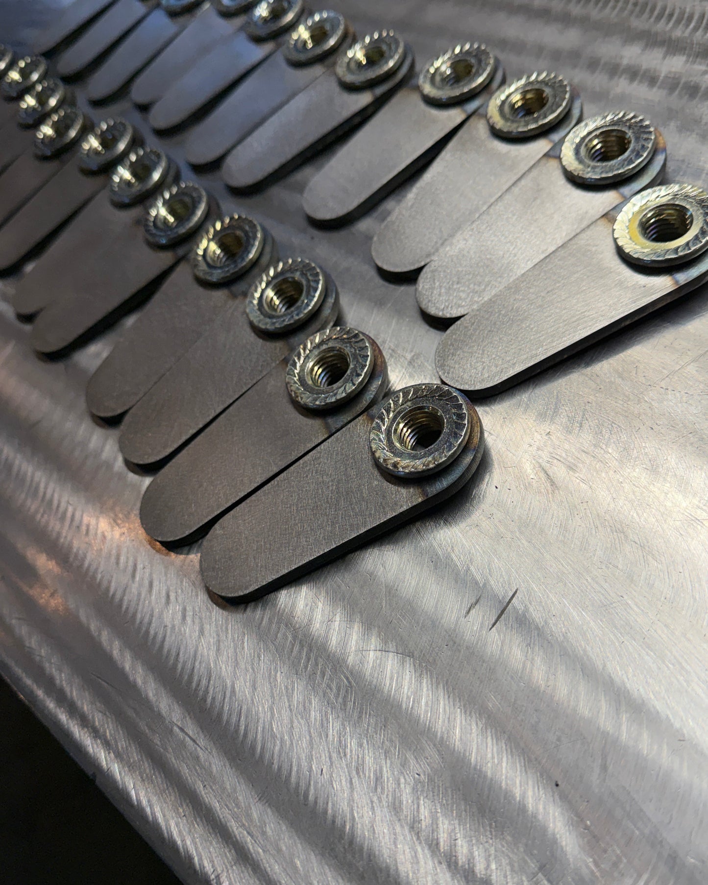 4th gen RAM 1500 Rear Upper Shock Nuts with Tabs, close up bulk