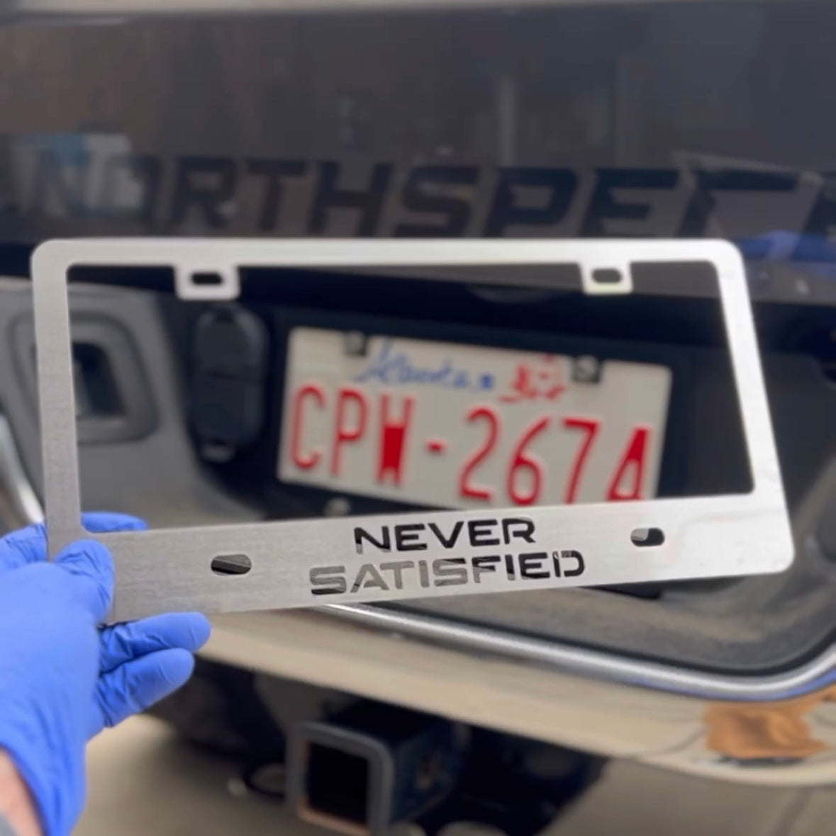 NEVER SATISFIED Stainless License Plate Frame