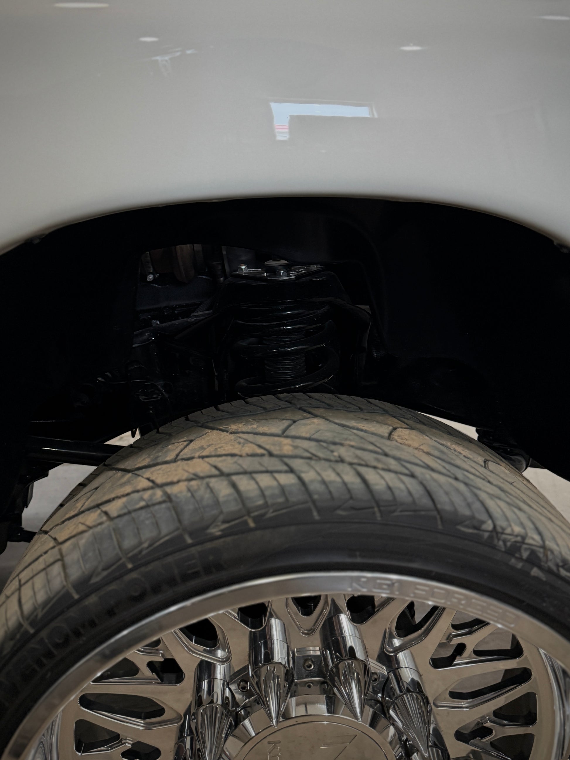 2nd gen, 3rd gen, 4th gen Shock Tower Delete Plates (1994 - 2012 Dodge 2500/3500) installed side view powder coated black with polished overlays 