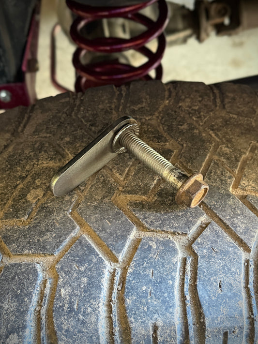 4th gen RAM 1500 Rear Upper Shock Nuts with Tabs Raw steel close up