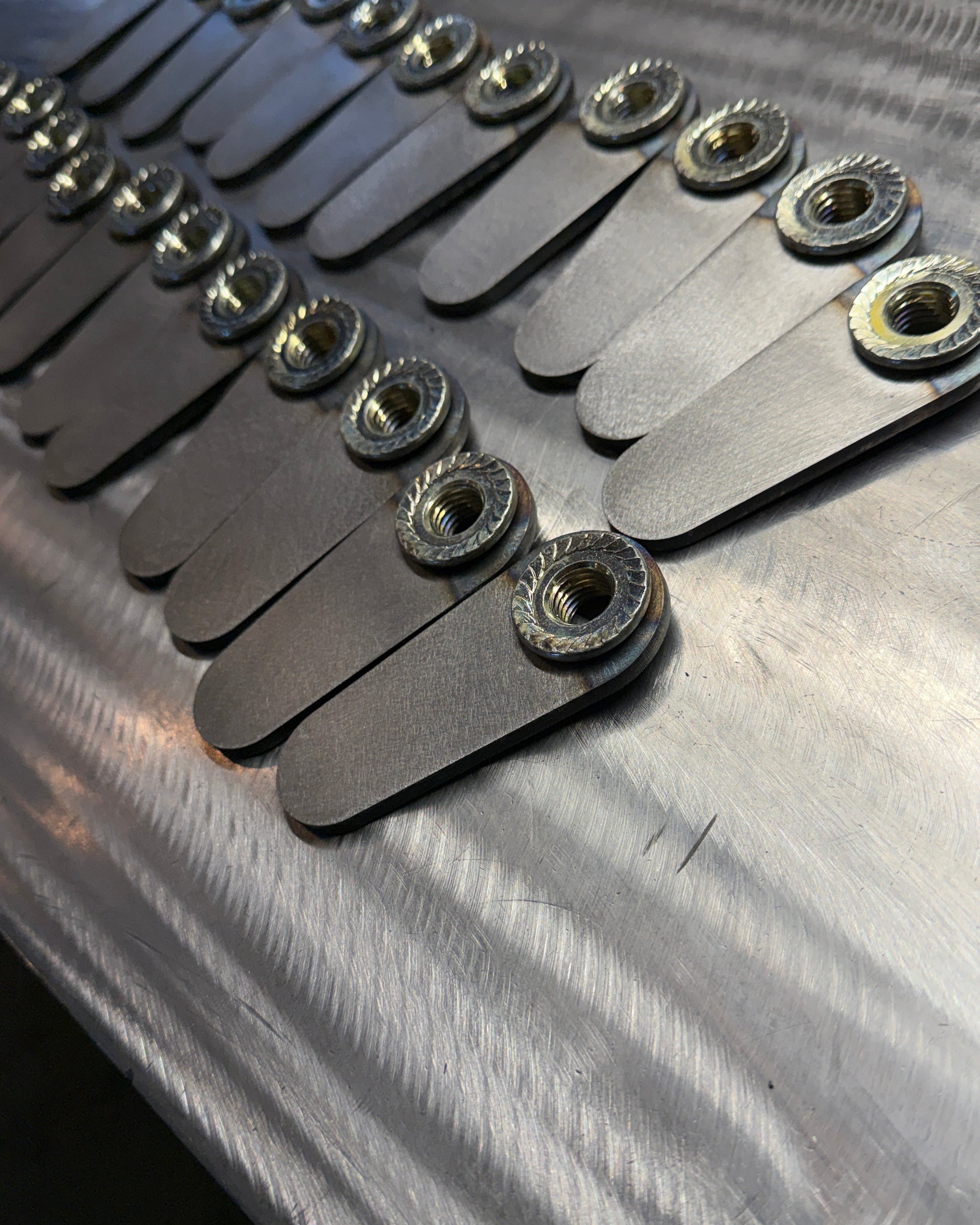 4th gen RAM 1500 Rear Upper Shock Nuts with Tabs, close up bulk 