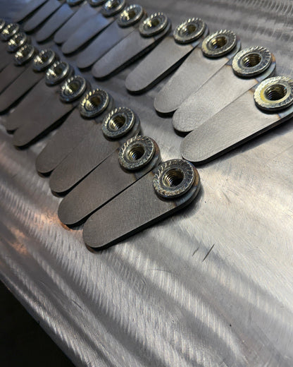 4th gen RAM 1500 Rear Upper Shock Nuts with Tabs, close up bulk 