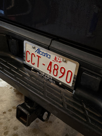 NEVER SATISFIED Stainless License Plate Frame (US & Canada)