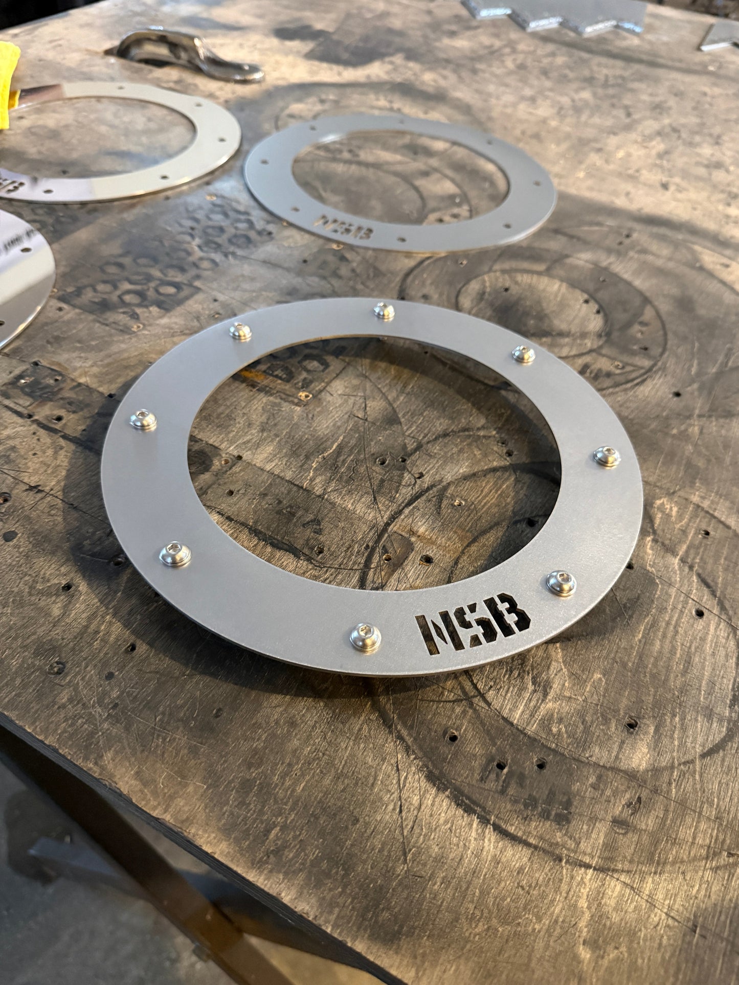7'' Northspec Built exhaust trim bezel close up raw stainless steel with button head bolts