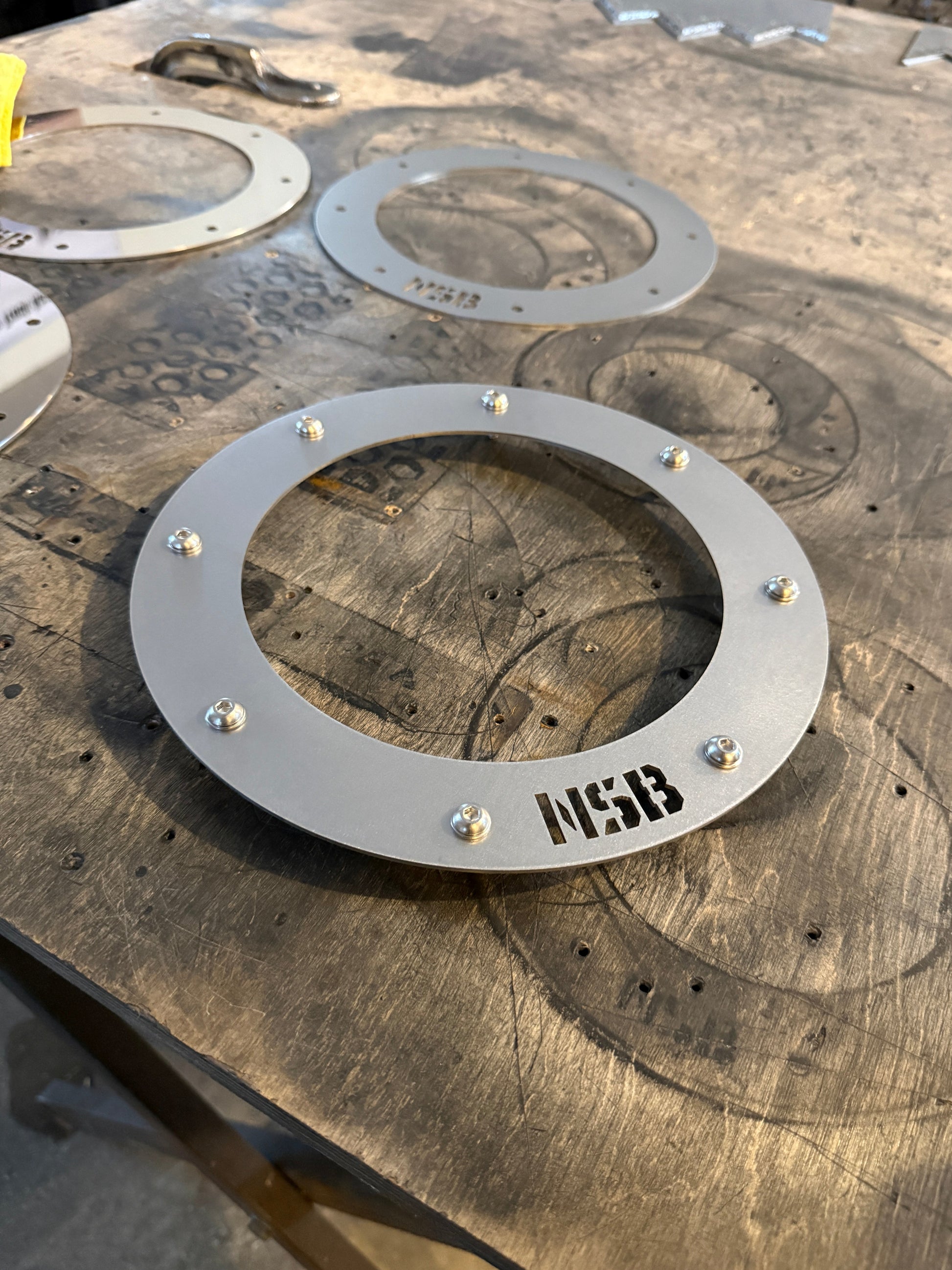 7'' Northspec Built exhaust trim bezel close up raw stainless steel with button head bolts