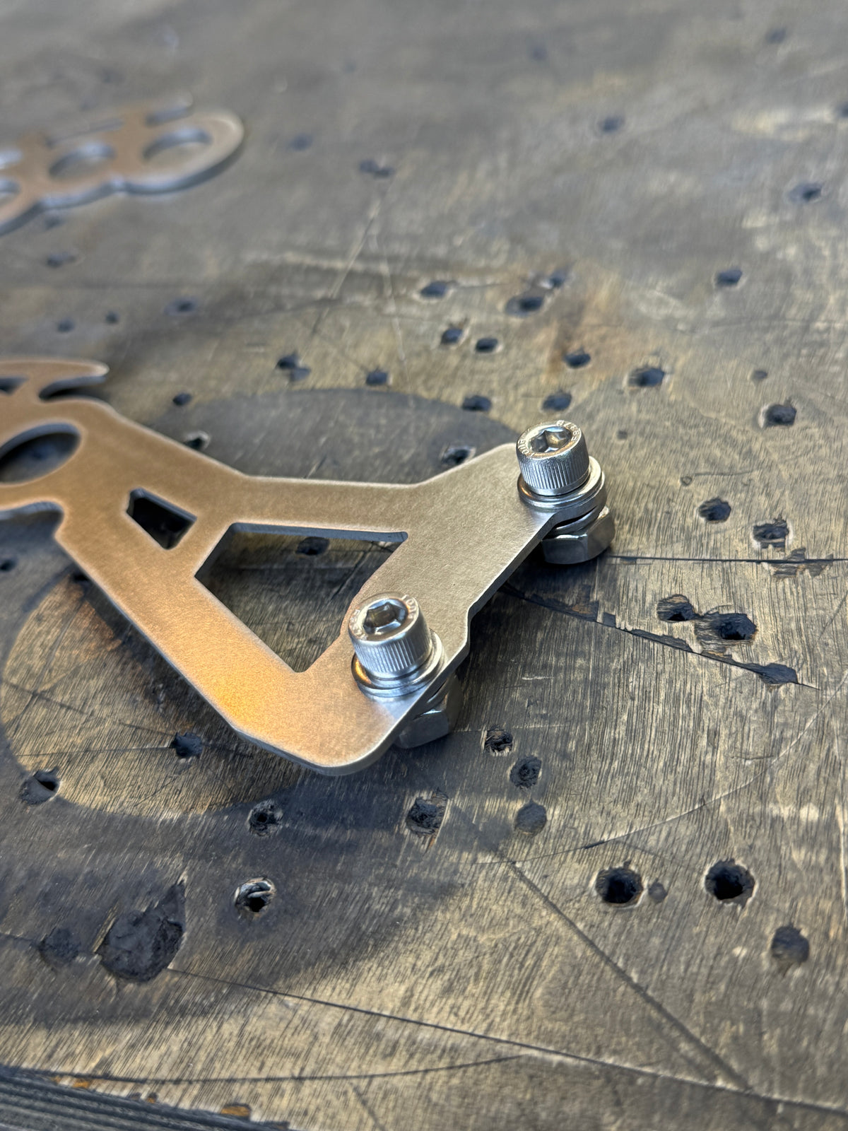 Can-Am Maverick X3 factory door handle replacement raw steel knuckle design hardware close up raw stainless steel