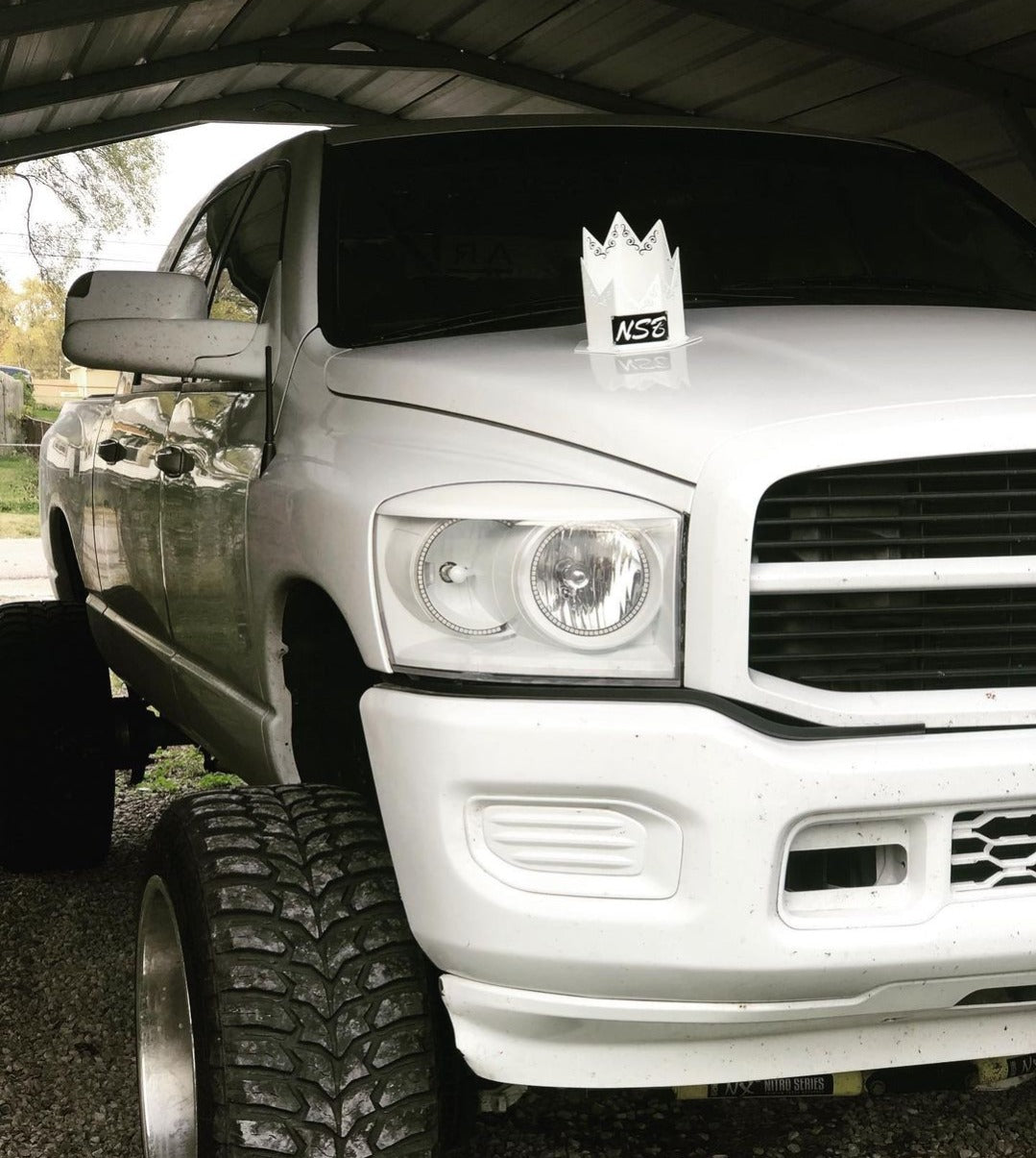 Custom spiked Hood Stack tip white with swirl cutouts installed on the truck 