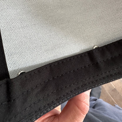 High quality snapback hat close up view of emblem rivets