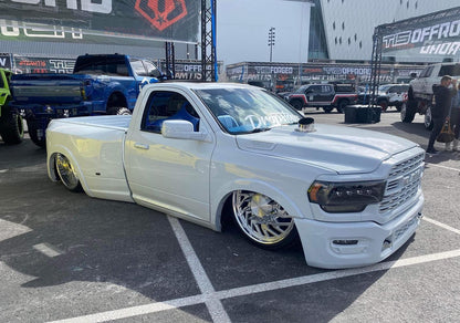 polished stainless steel Hood Stack installed on a lowered ram truck at sema show 