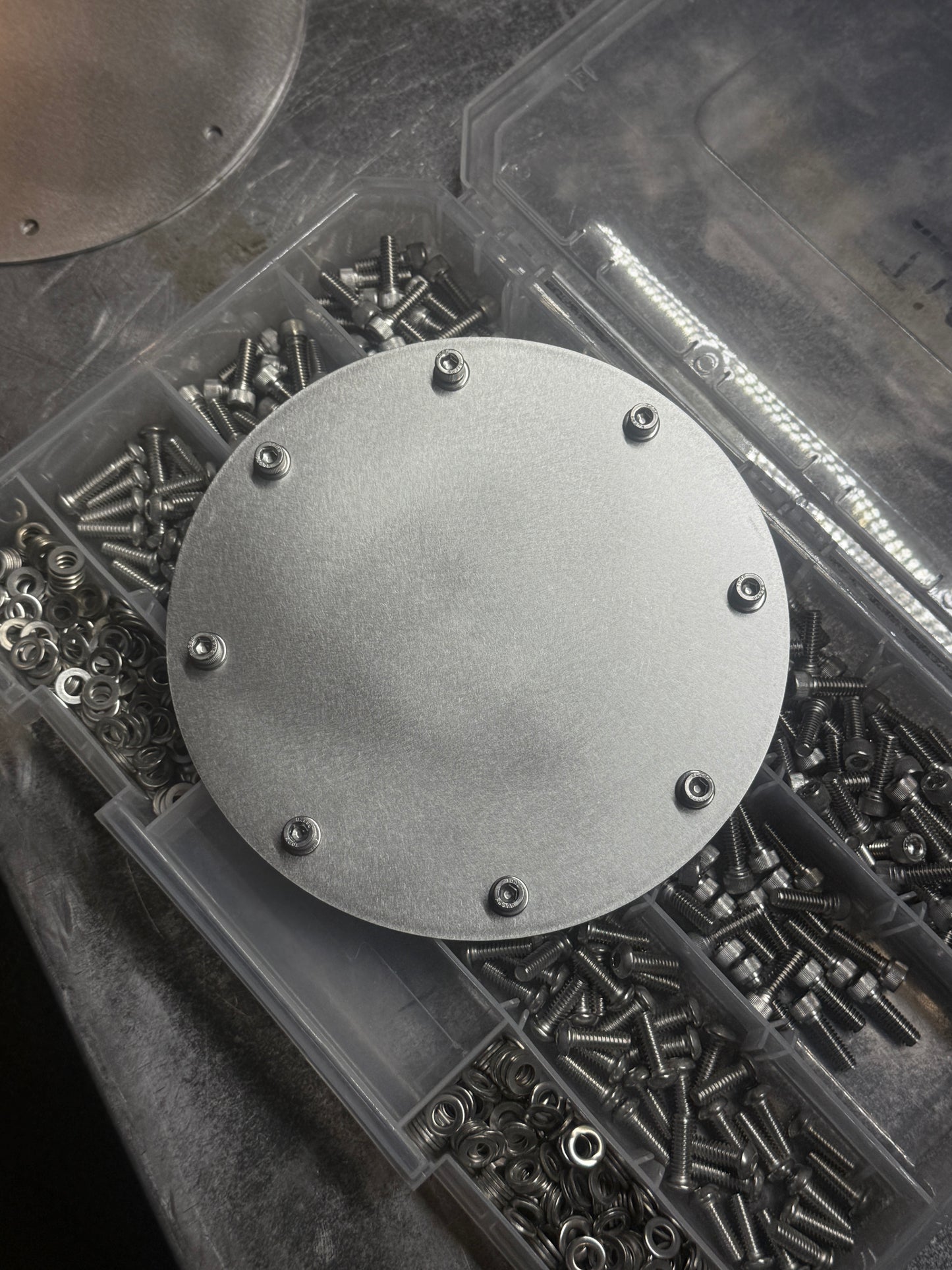 hood stack cover plate close up with hardware Raw stainless steel
