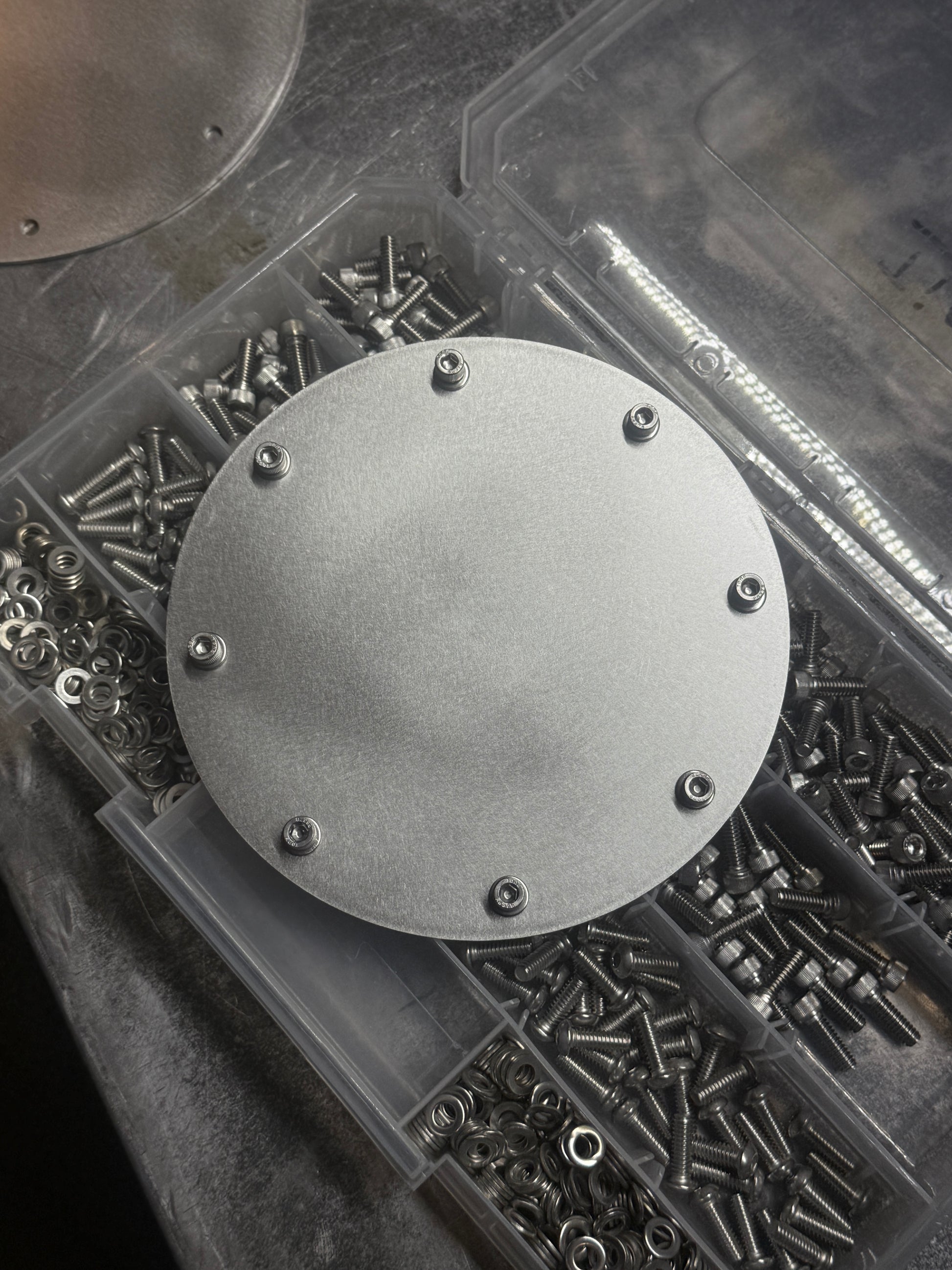 hood stack cover plate close up with hardware Raw stainless steel