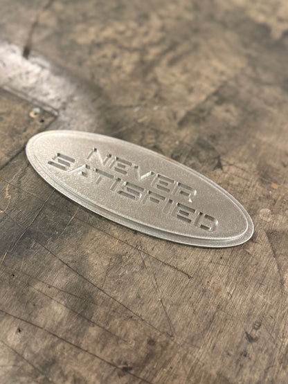 "Never Satisfied" Emblem (Ford 7" Universal Fitment)
