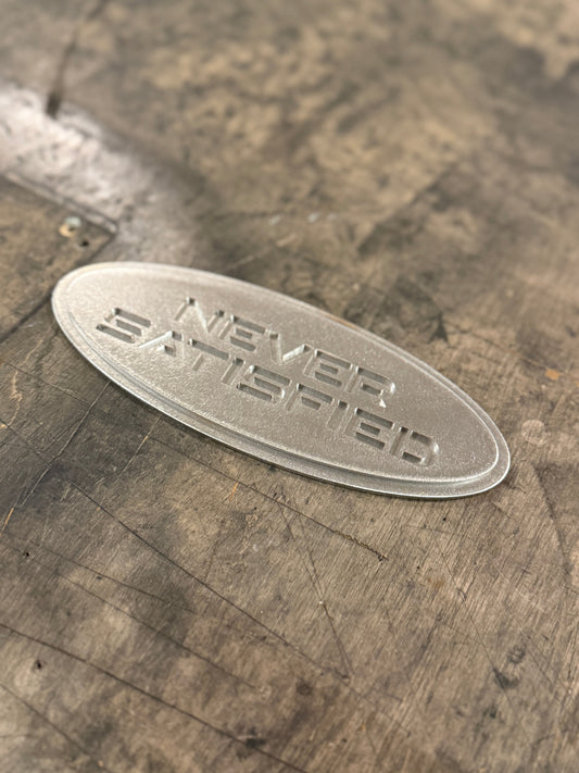 "Never Satisfied" Emblem (Ford 7" Universal Fitment)