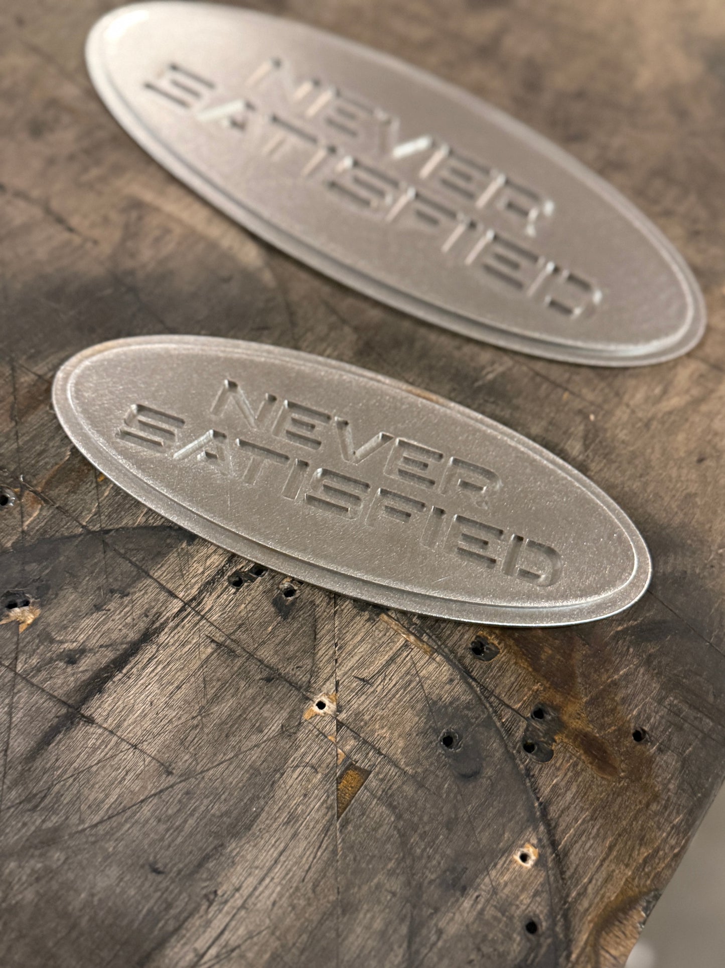 "Never Satisfied" Emblem (Ford 7" Universal Fitment)