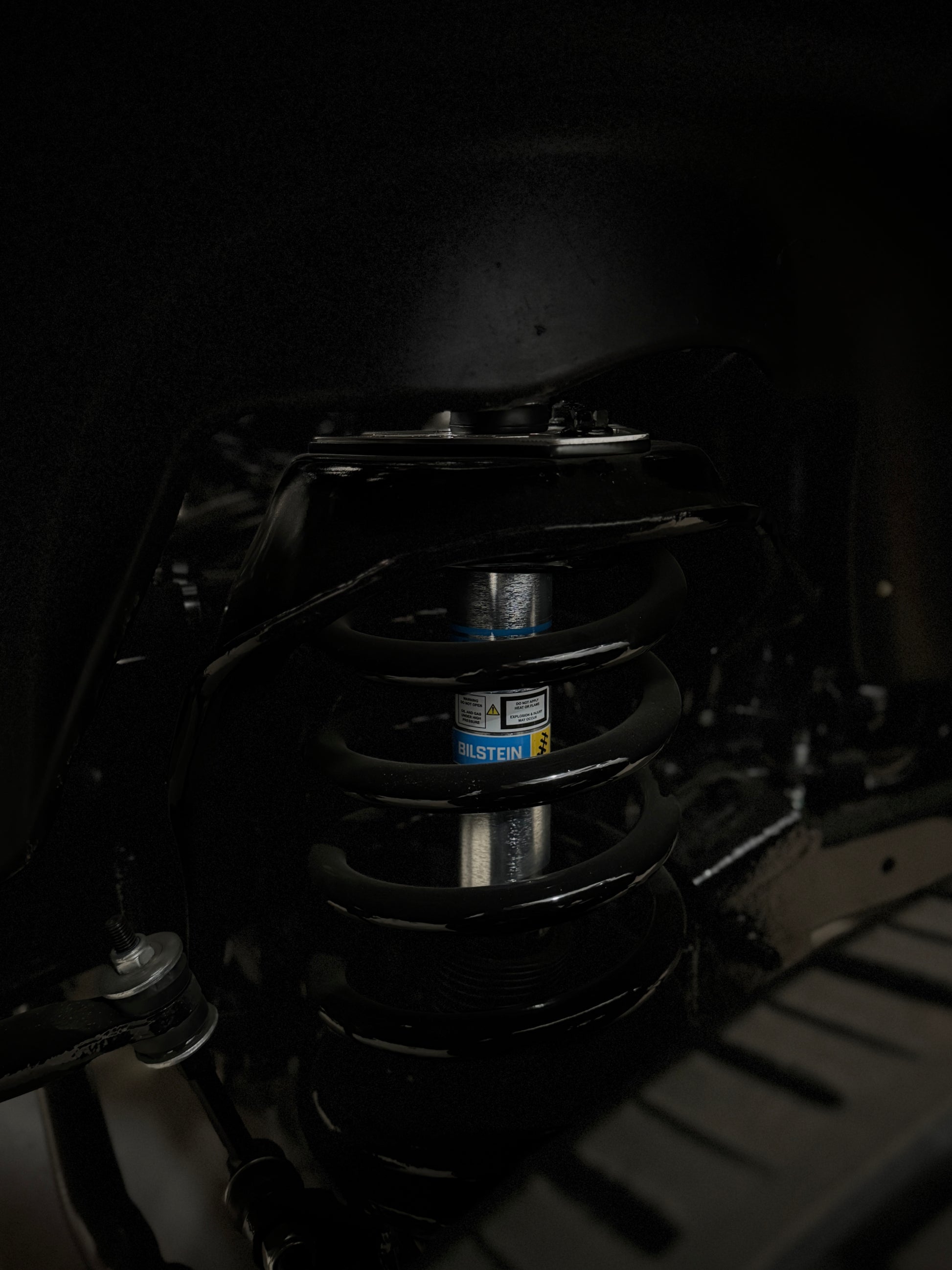 2nd gen, 3rd gen, 4th gen Shock Tower Delete Plates (1994 - 2012 Dodge 2500/3500) zoomed in installed side view powder coated black with polished overlays 