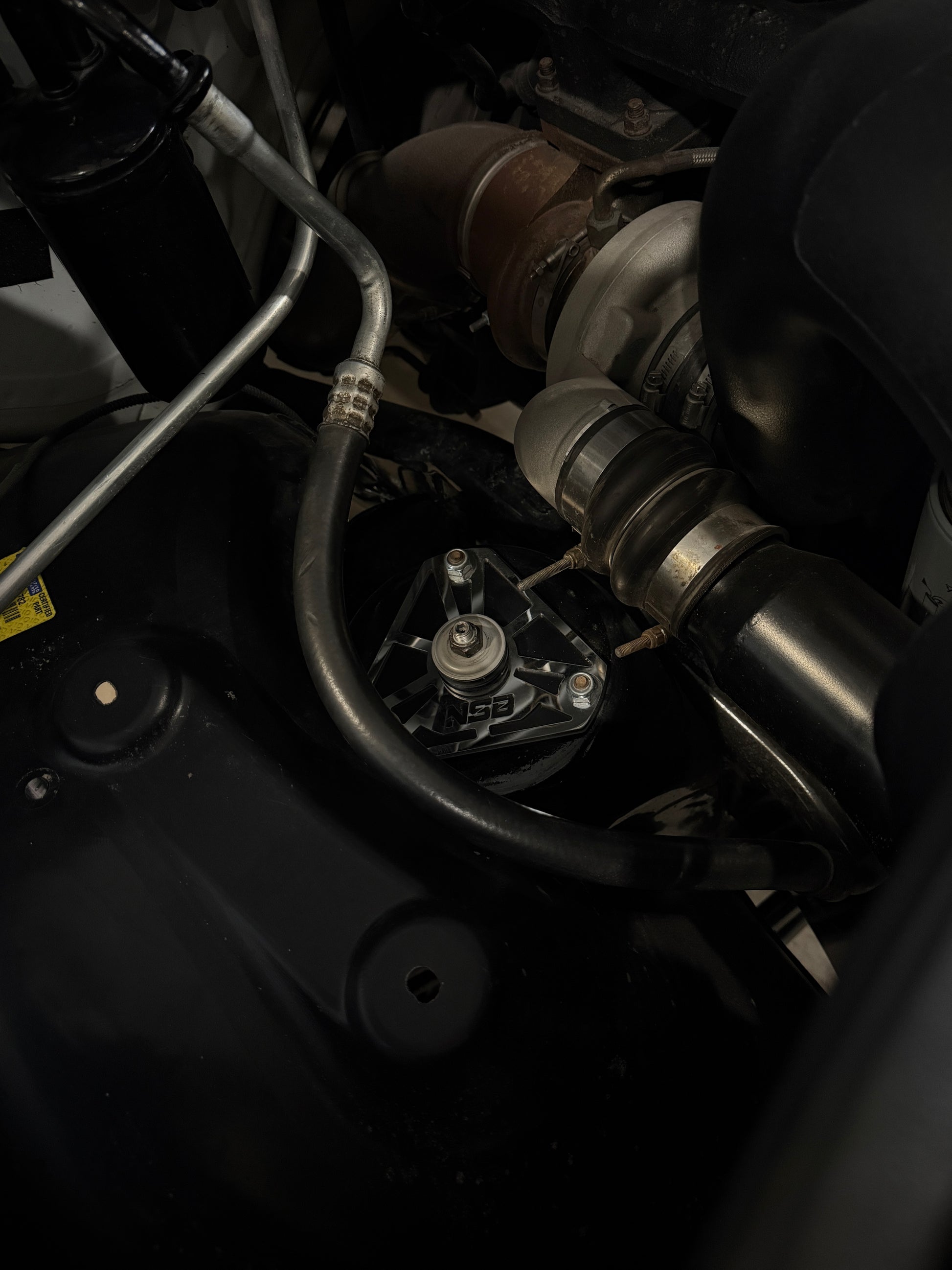 2nd gen, 3rd gen, 4th gen Low profile Shock mounts (1994 - 2012 Dodge 2500/3500) zoomed in  installed view powder coated black with polished overlays 