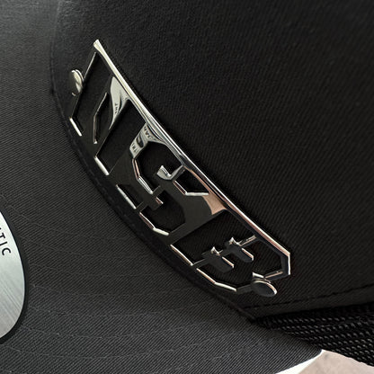 NSB Snapback hat with polished emblem close up detailed view  
