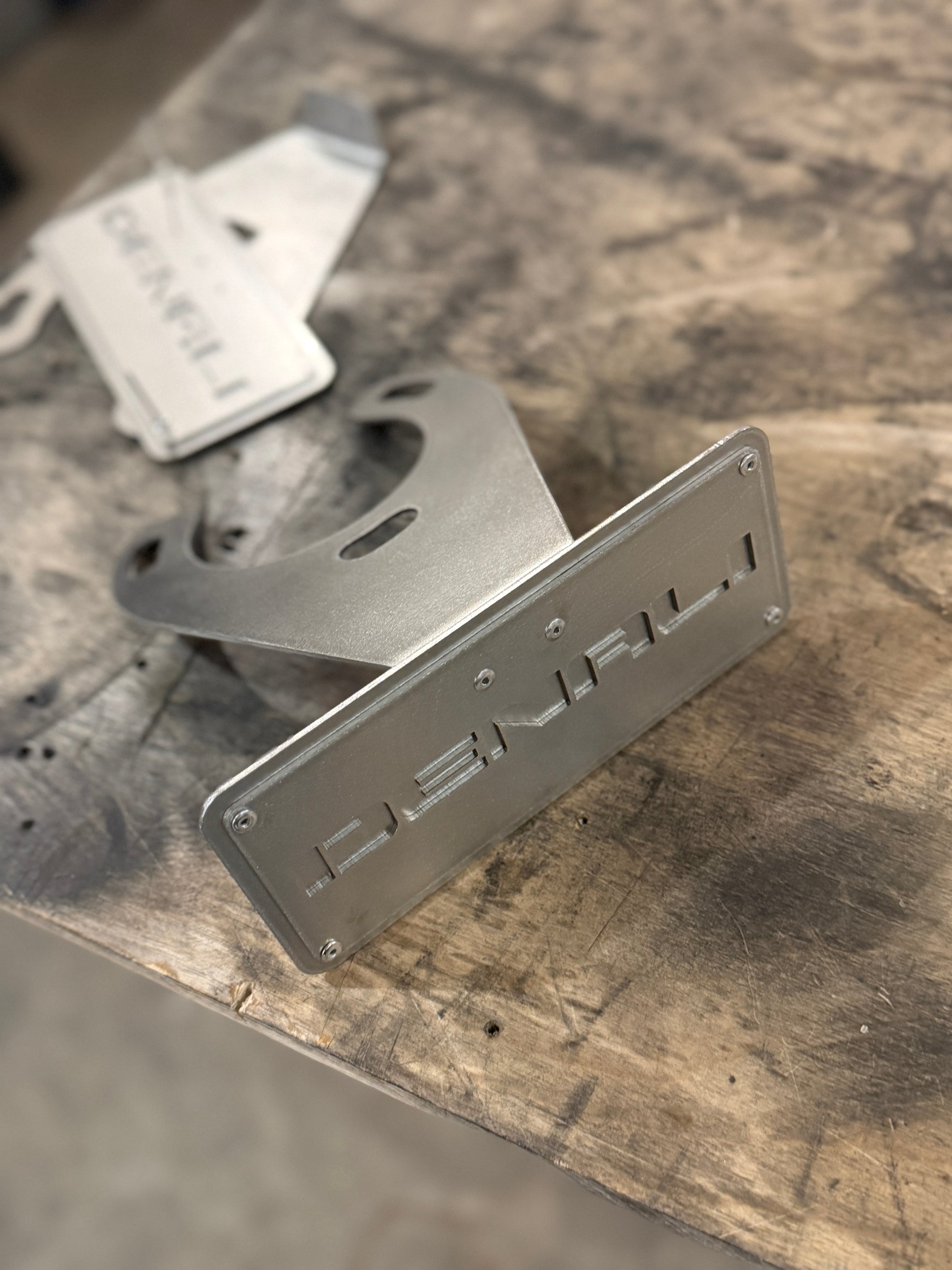 denali spring plates raw stainless steel close up view 