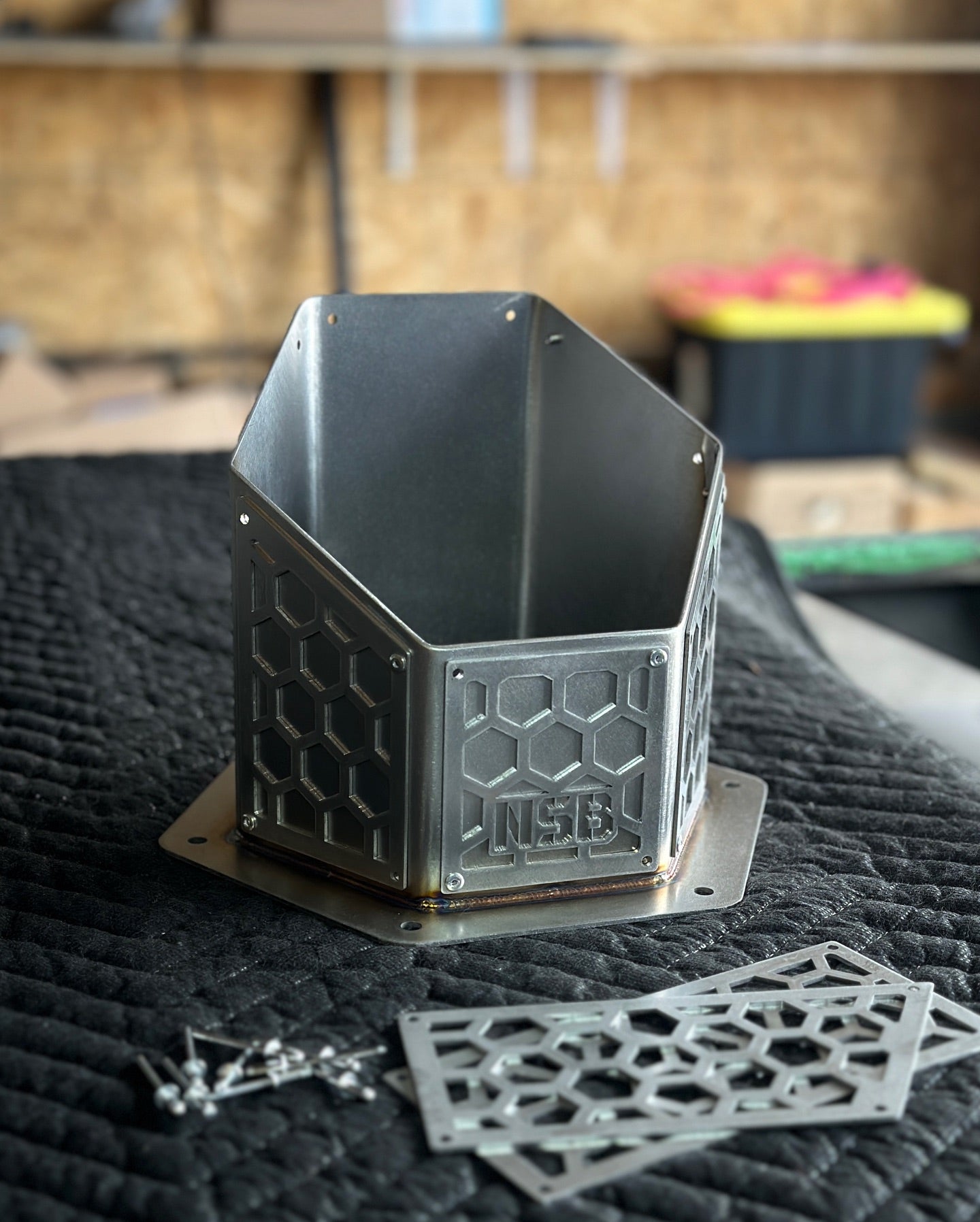 Northspec built hexagon overlay hood stack raw steel close up view 