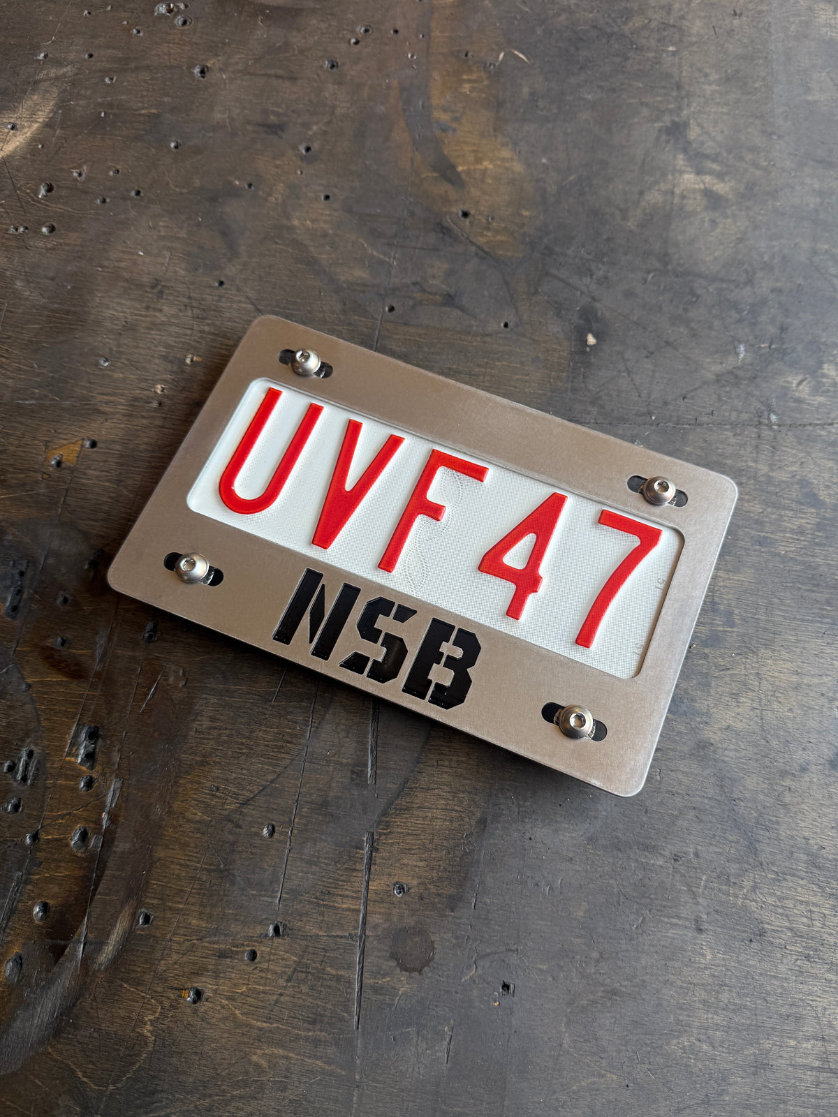 OHV Stainless License Plate Frame raw steel close up