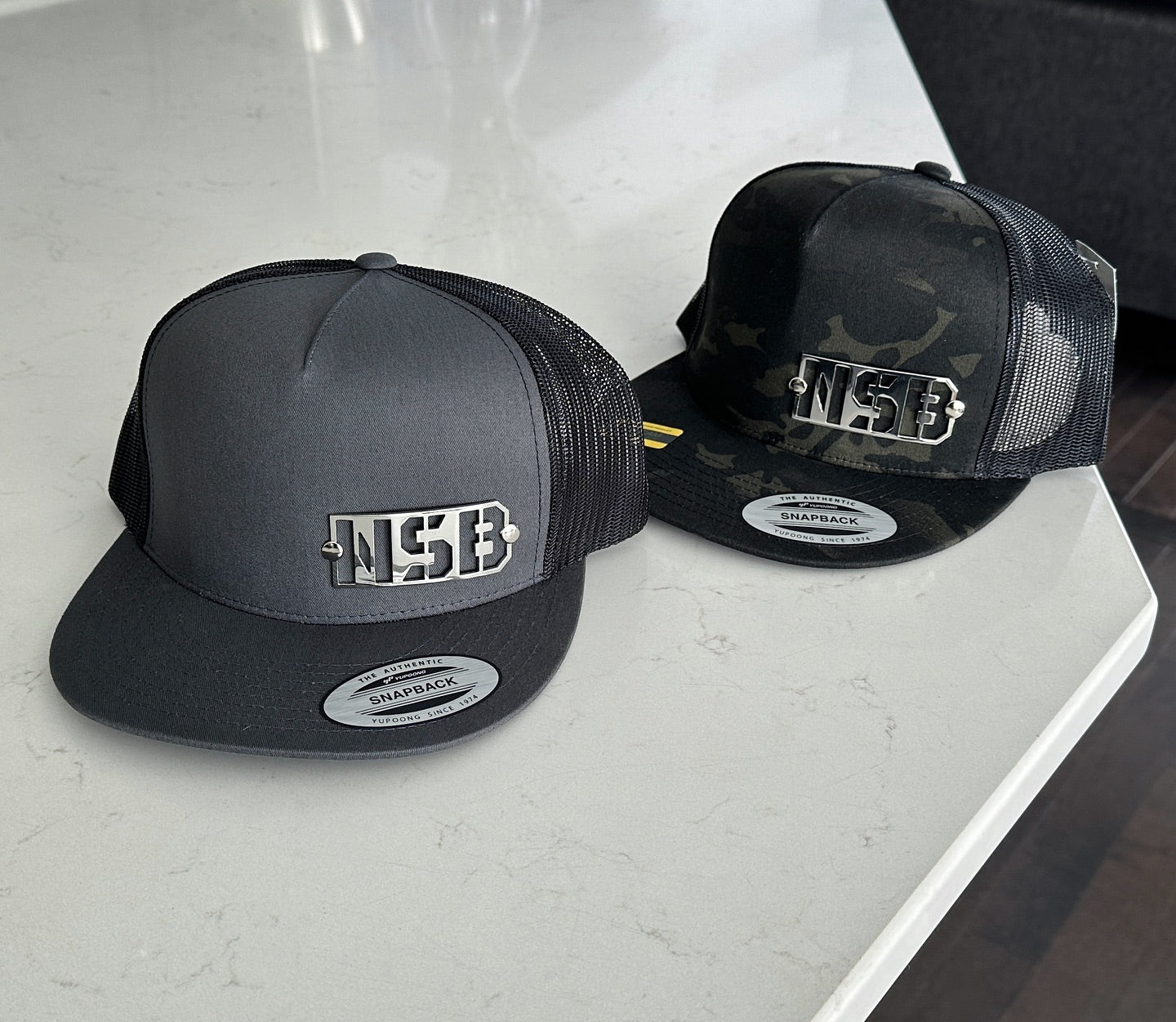 NSB Snapback Hat camo and grey combo with polished emblem