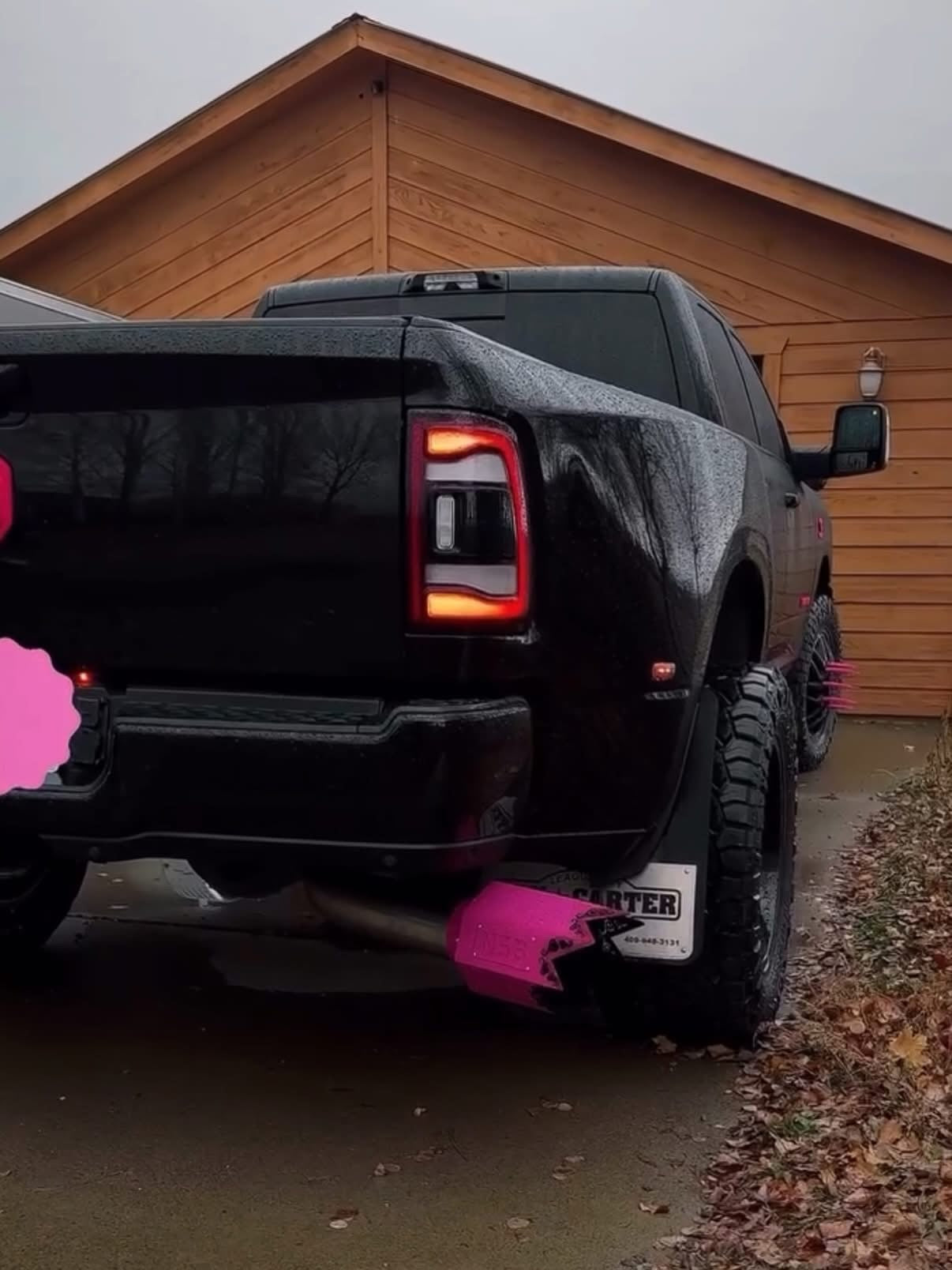 Spiked exhaust tip installed on a truck with swirl cutouts hot pink color