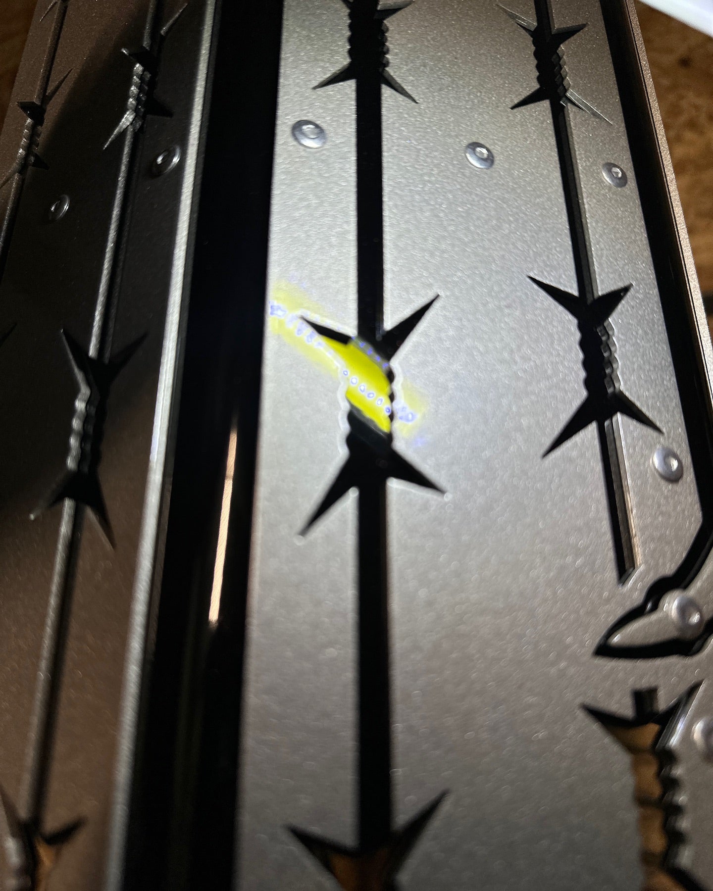custom barbed wire overlays exhaust tip zoomed in view of the overlays 