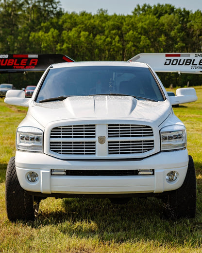 3rd gen dodge cummins dually running a custom NSB stainless ram grille badge