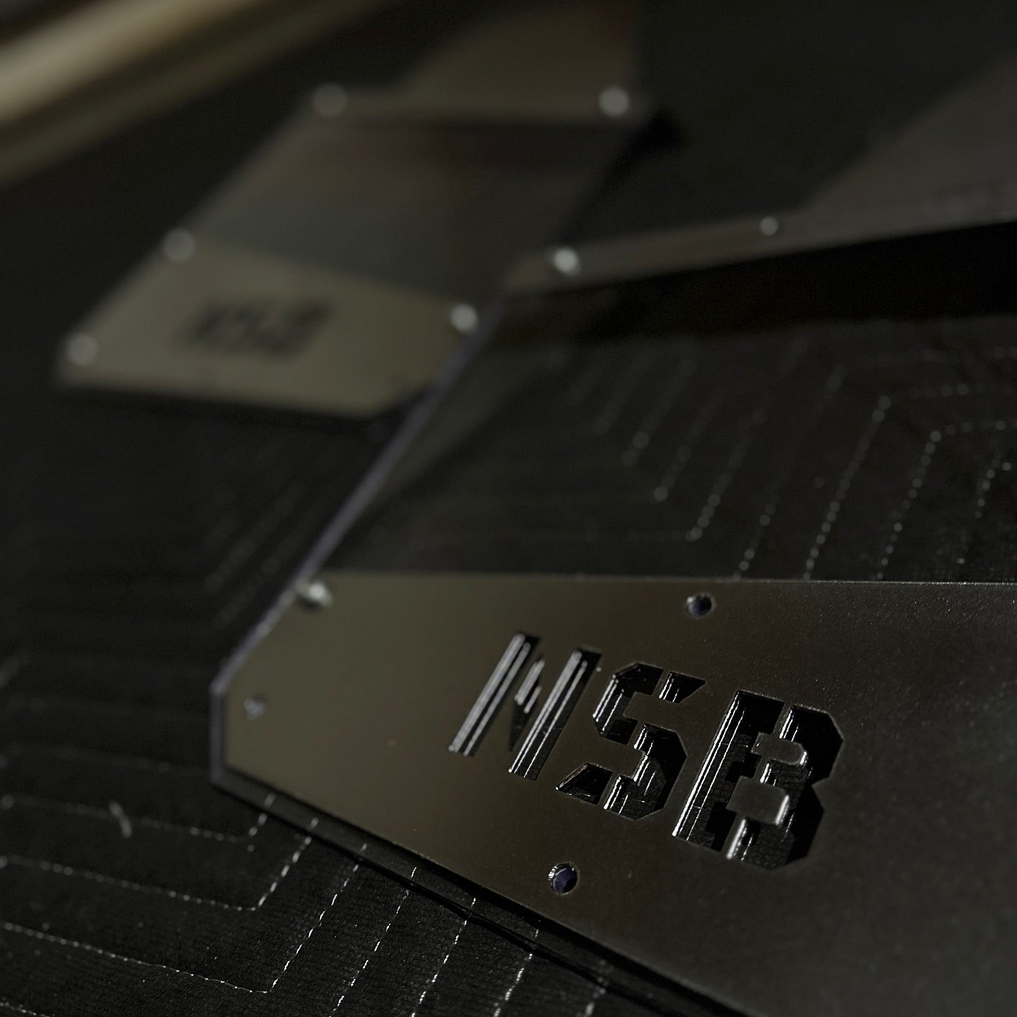 transparent kick back mud flaps for wide tires universal fitment close up view of the kick back plates 