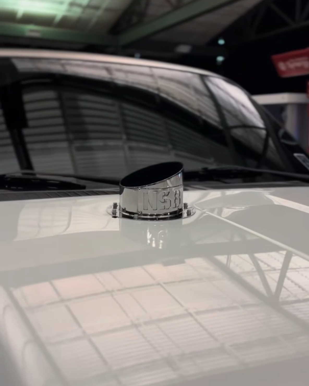 polished chrome aluminum finish hood stack tip installed close up view